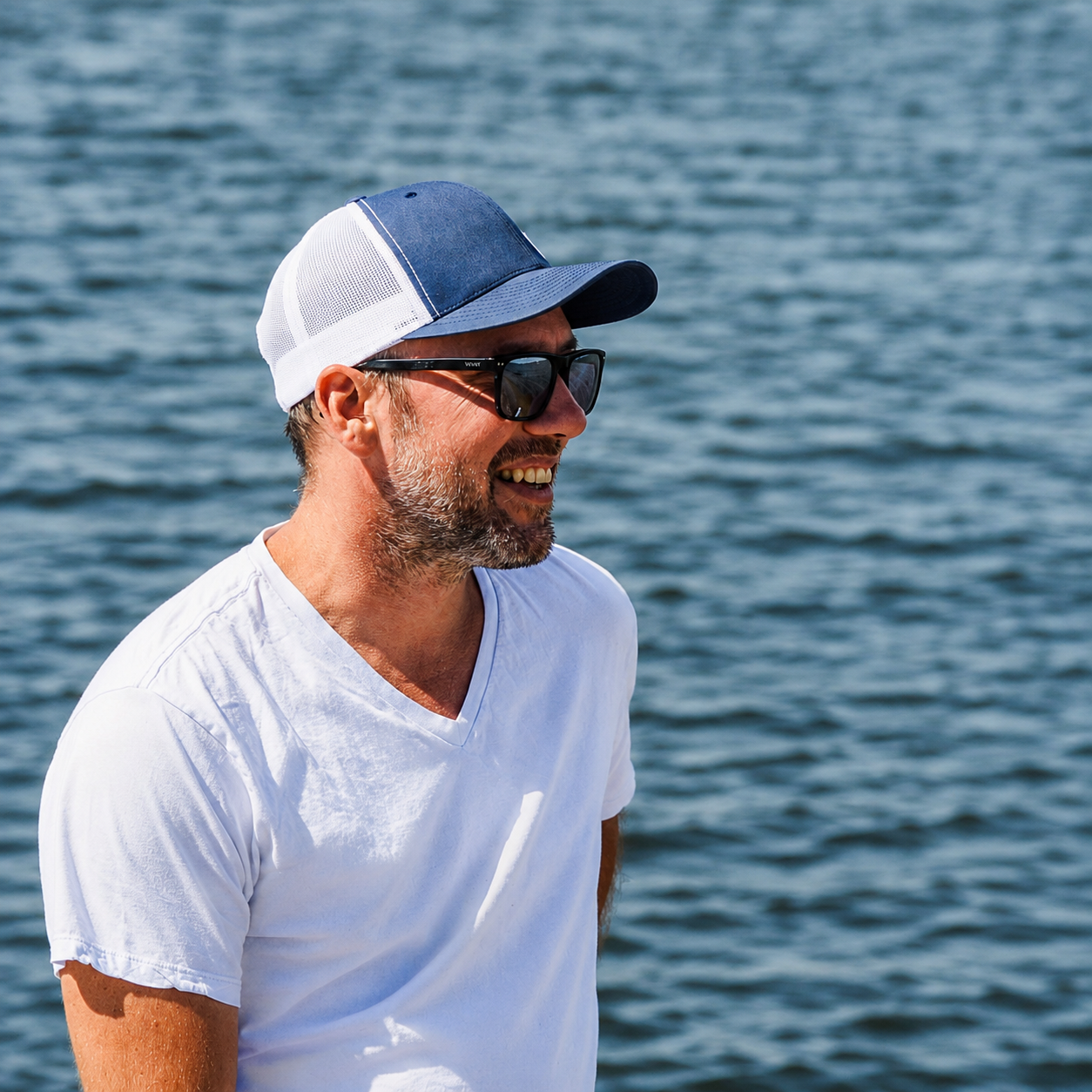 Scott Riddell outdoors by the water